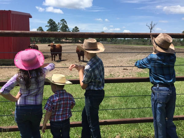 The Speedy children at the family's Texas farm